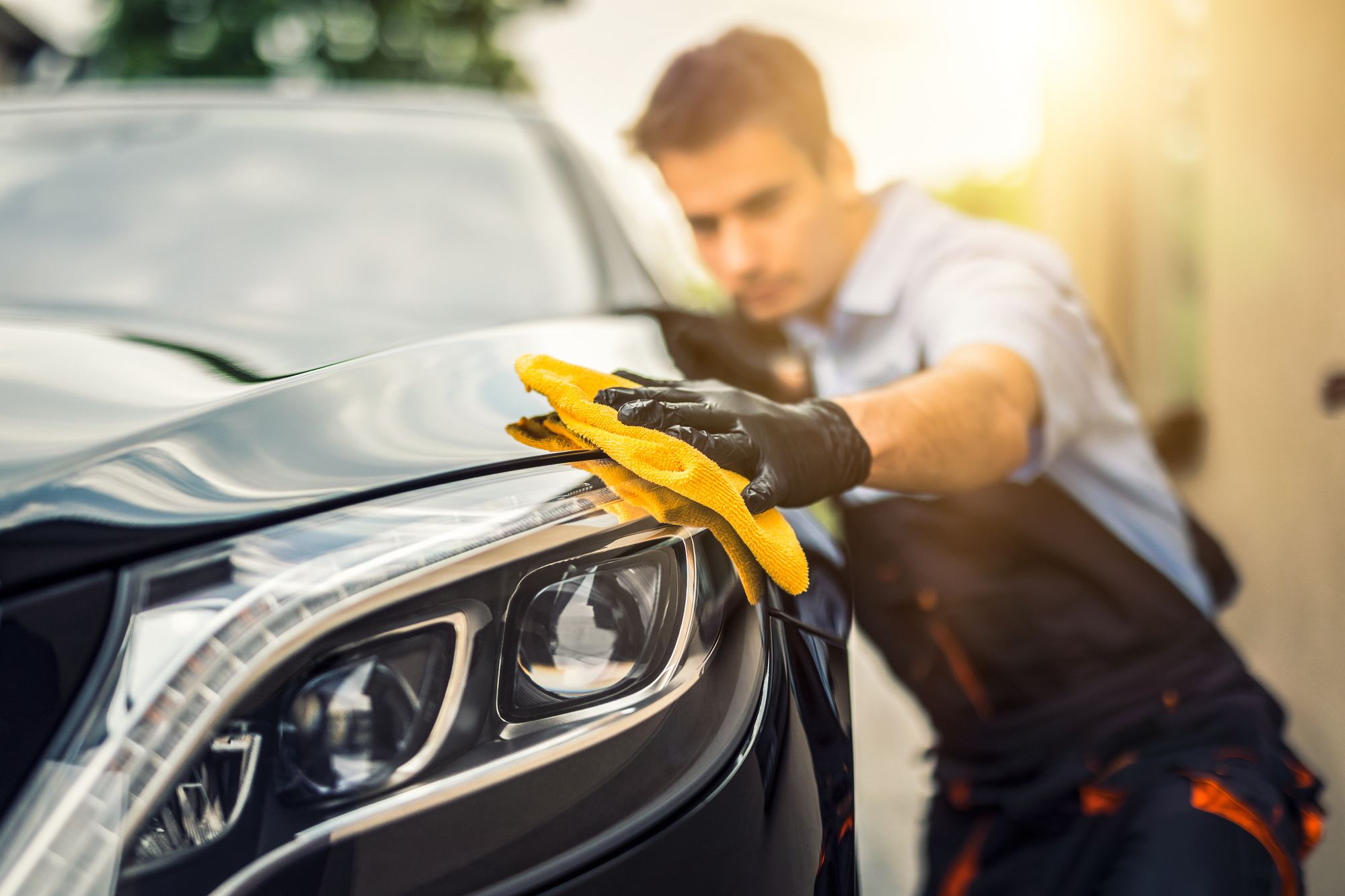 Man cleaning a car